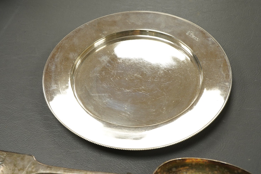 A Victorian silver side plate or stand, by John Edward Bingham (Walker & Hall), Sheffield, 1885, diameter 17.9cm, together with an early 20th century silver cream jug and sugar bowl by Barker Brothers and a Victorian pro